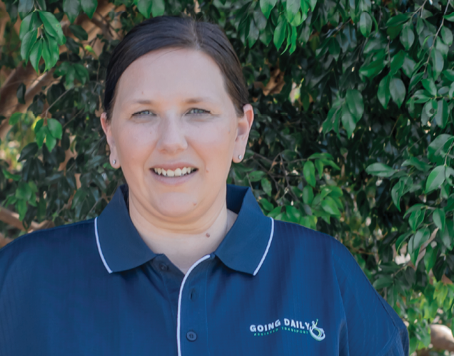 Portrait of Jodi, founder of Growing Daily, smiling outdoors