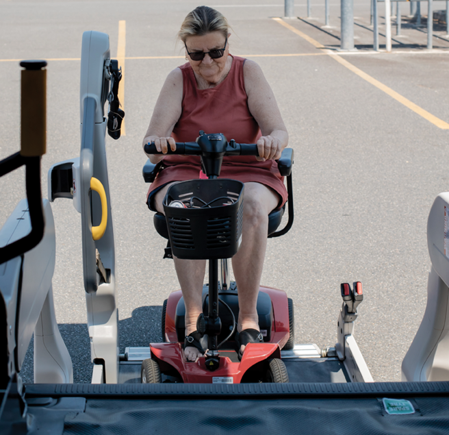 Woman using a scooter lift for transportation